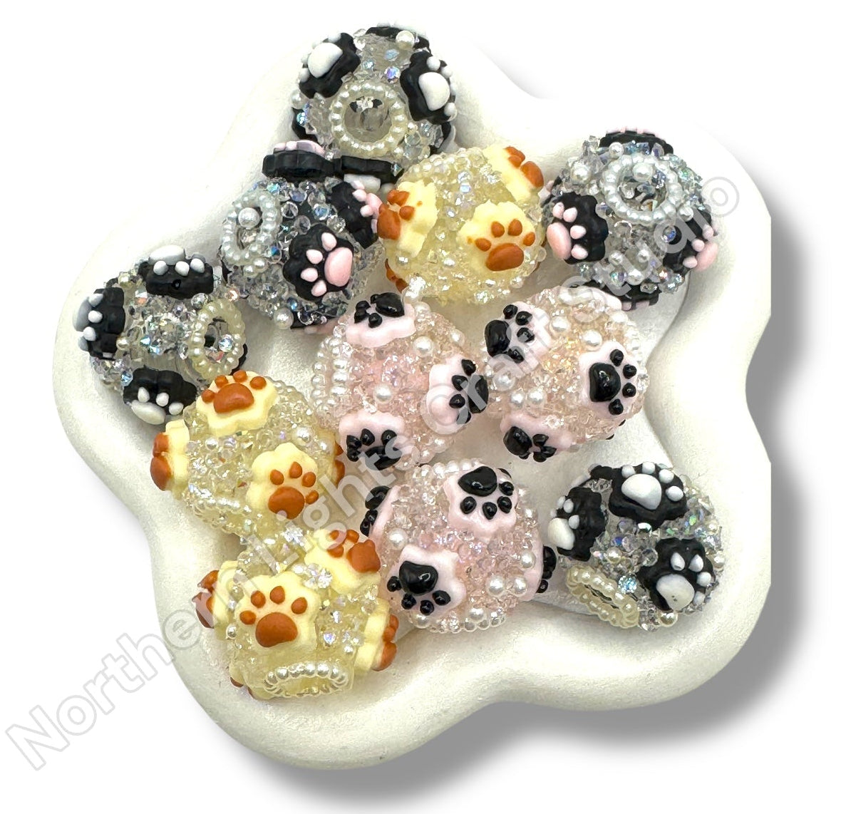 Decorative paw print with multicolored paw prints on a white background
